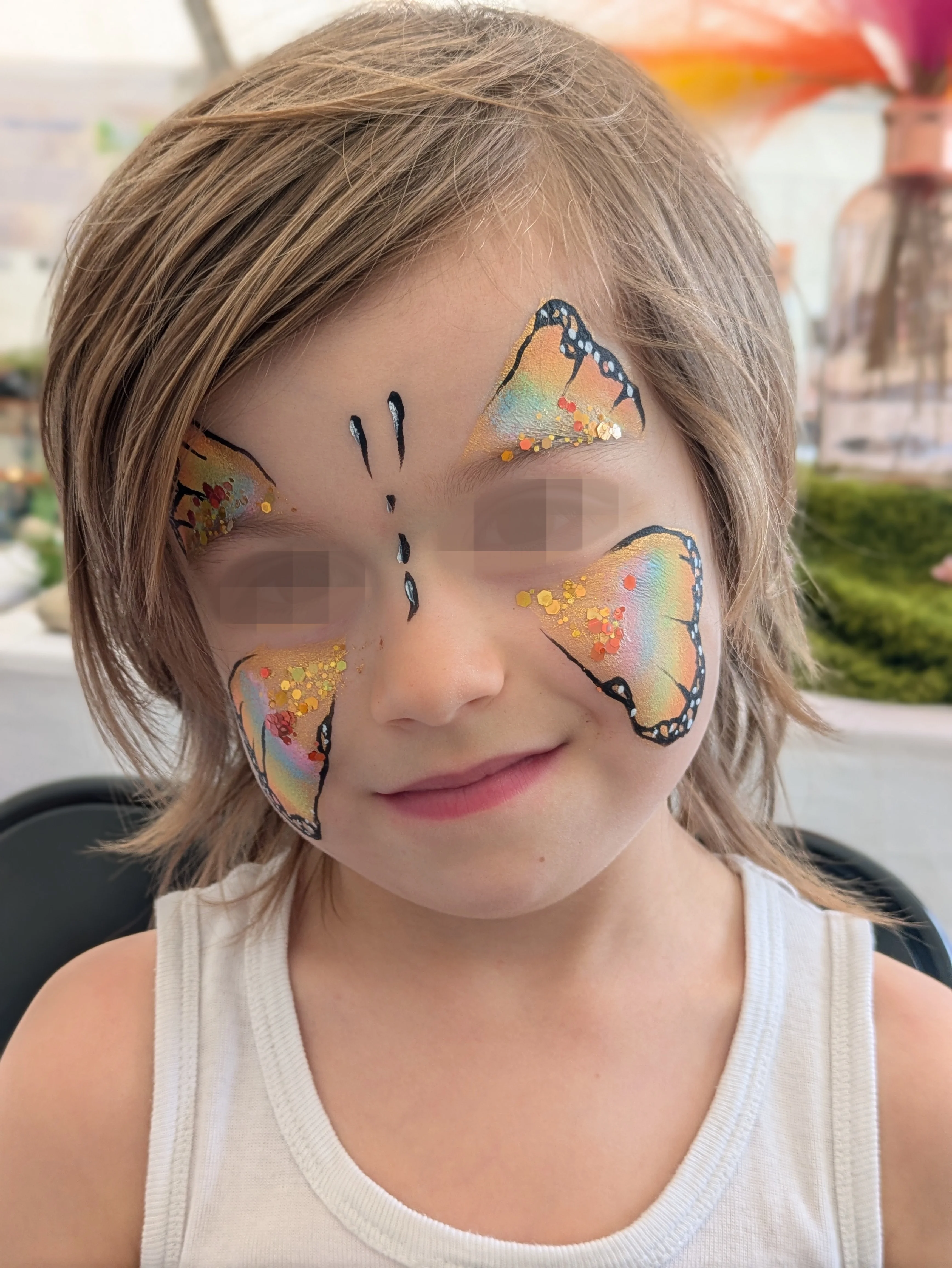 Maquillage artistique enfant papillon multicolore r&eacute;alis&eacute; par L'Atelier de Macete en Alsace